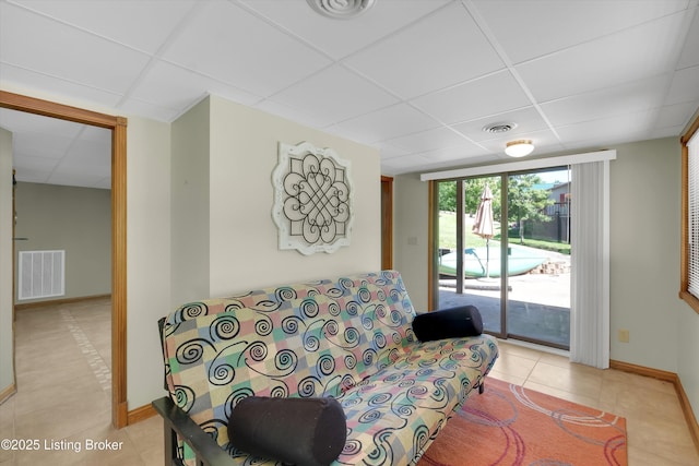 763 Lochober Rd, Leitchfield, KY 42754 - living area with a drop ceiling, baseboards, and light tile patterned flooring