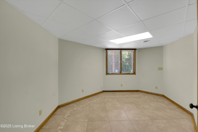 763 Lochober Rd, Leitchfield, KY 42754 - unfurnished room with baseboards, a drop ceiling, and light tile patterned flooring