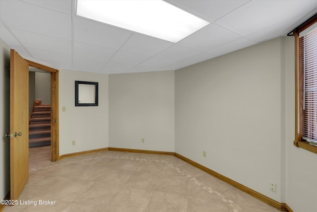 763 Lochober Rd, Leitchfield, KY 42754 - spare room with a paneled ceiling, stairs, and baseboards