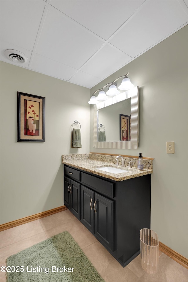 763 Lochober Rd, Leitchfield, KY 42754 - bathroom featuring vanity, baseboards, tile patterned flooring, and a paneled ceiling