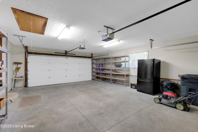 763 Lochober Rd, Leitchfield, KY 42754 - garage featuring freestanding refrigerator and a garage door opener