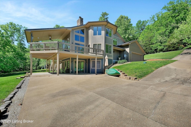 763 Lochober Rd, Leitchfield, KY 42754 - rear view of house featuring a carport, a lawn, a chimney, and concrete driveway