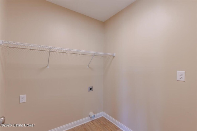 102 Kidd Ct, Lebanon Junction, KY 40150 - laundry room with hookup for an electric dryer, baseboards, and light wood-style flooring