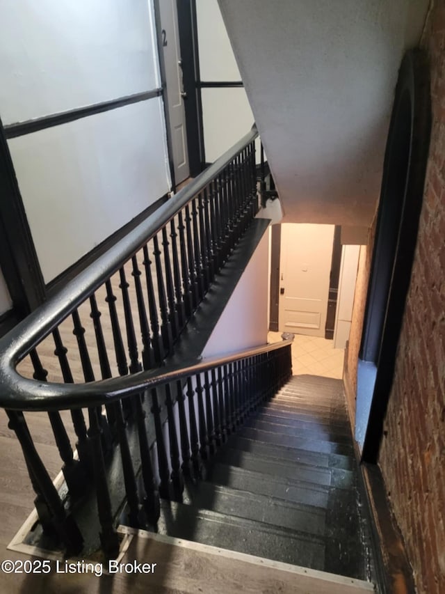 224 E Oak St, Louisville, KY 40203 - stairs featuring wood finished floors