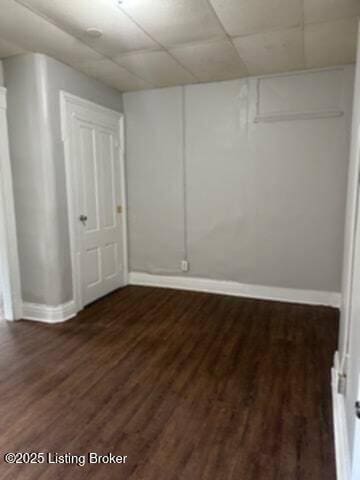 224 E Oak St, Louisville, KY 40203 - basement with baseboards and dark wood-style flooring