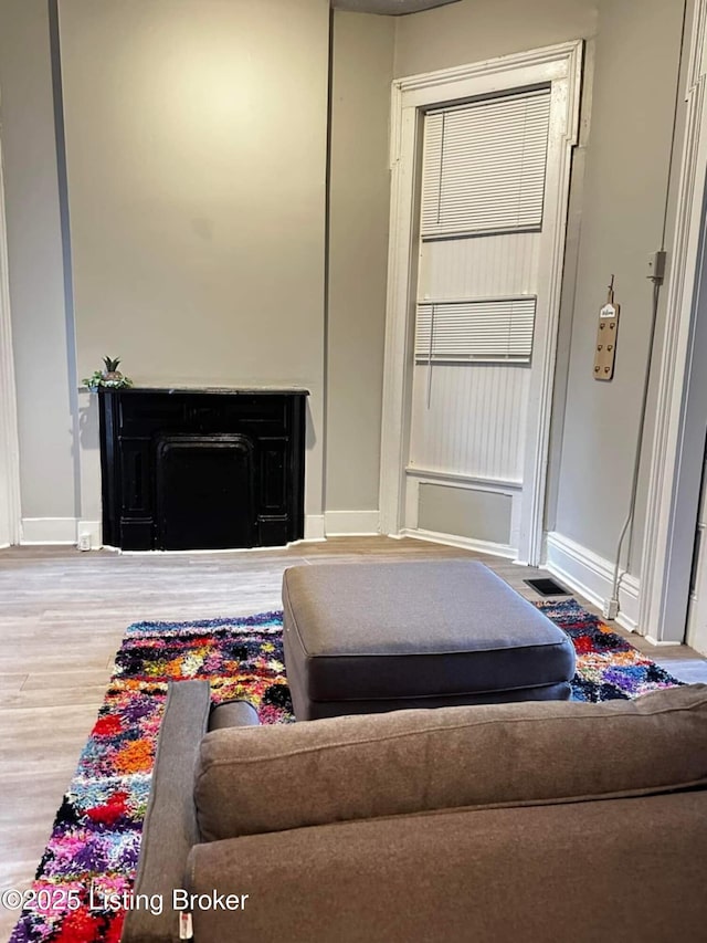 224 E Oak St, Louisville, KY 40203 - living room with baseboards and wood finished floors