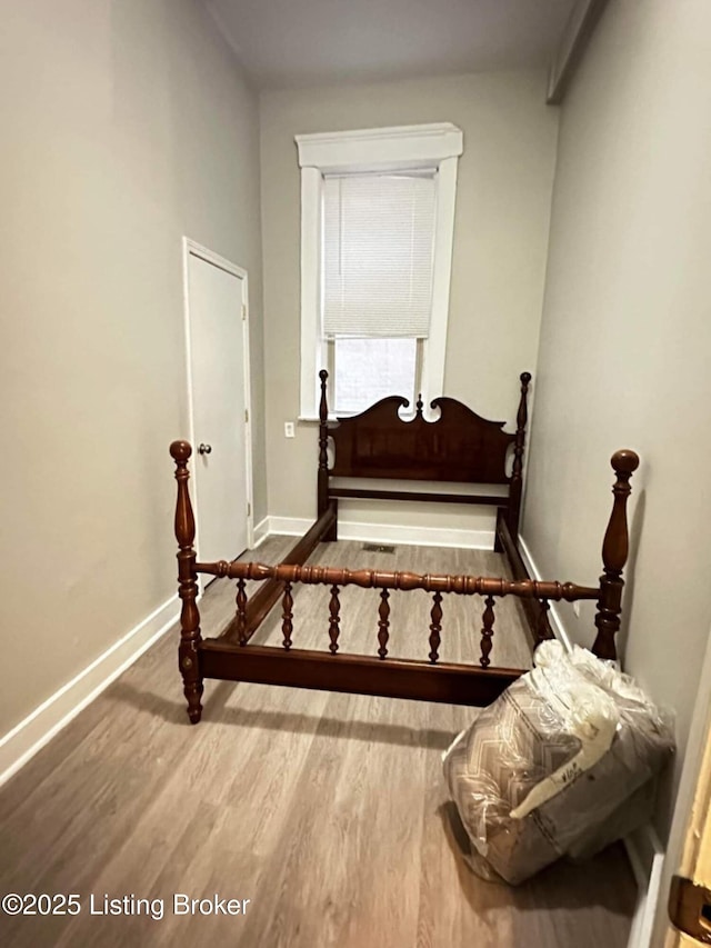 224 E Oak St, Louisville, KY 40203 - bedroom with wood finished floors and baseboards