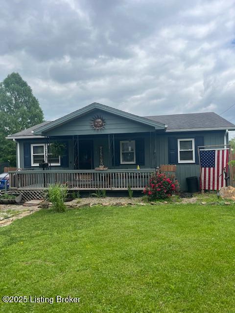 379 S High St, Austin, IN 47102 - view of front of house with a front lawn and covered porch