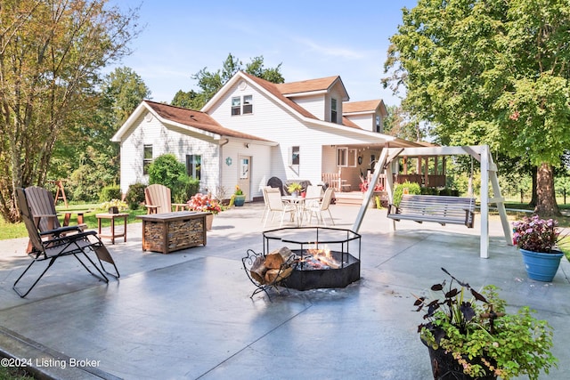 3297 E Gap Hill Rd, Cub Run, KY 42729 - rear view of property featuring an outdoor fire pit and a patio area