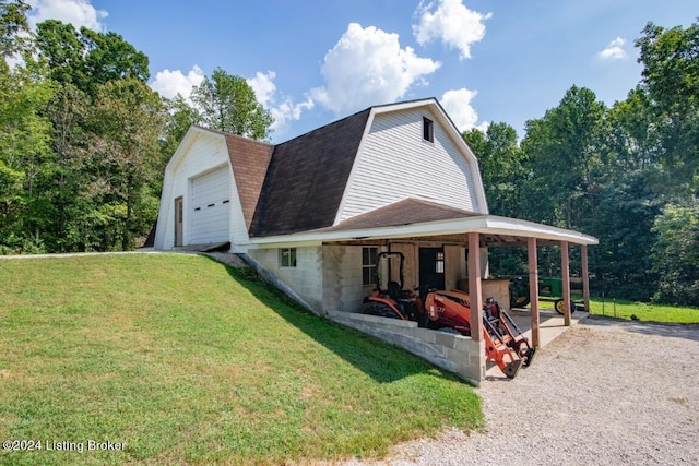 3297 E Gap Hill Rd, Cub Run, KY 42729 - view of home's exterior featuring a gambrel roof, a lawn, a shingled roof, and a detached garage