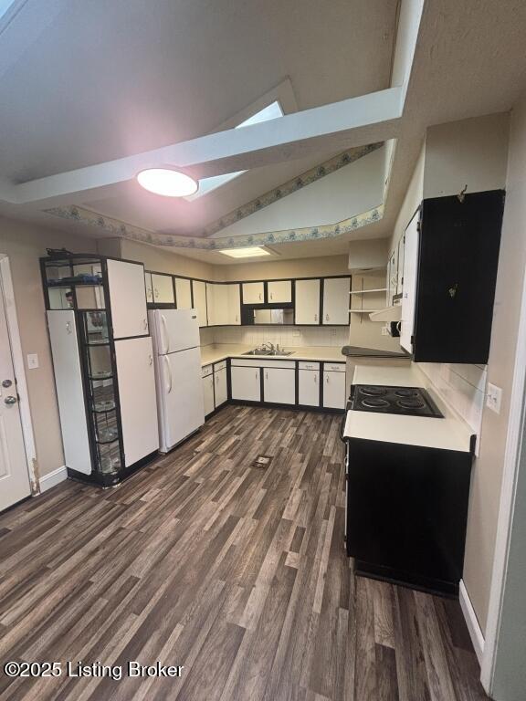 9304 New Maple Rd, Louisville, KY 40229 - kitchen with freestanding refrigerator, a sink, dark wood-style flooring, and baseboards