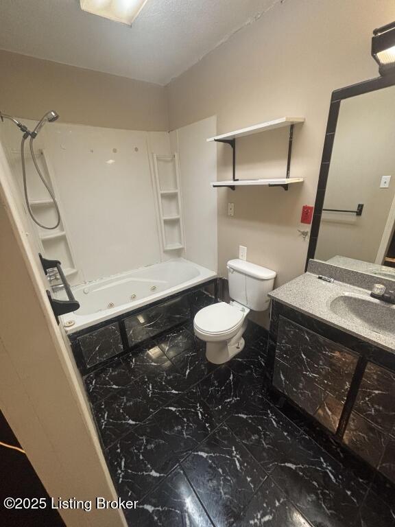9304 New Maple Rd, Louisville, KY 40229 - full bathroom featuring a combined bath / shower with jetted tub, toilet, marble finish flooring, and vanity