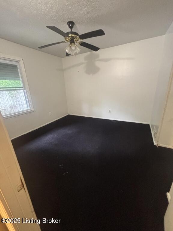 9304 New Maple Rd, Louisville, KY 40229 - spare room with a textured ceiling and ceiling fan