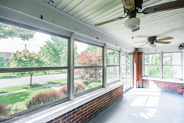 4714 Burkley Ave, Louisville, KY 40214 - unfurnished sunroom with ceiling fan, brick wall, healthy amount of natural light, and finished concrete floors