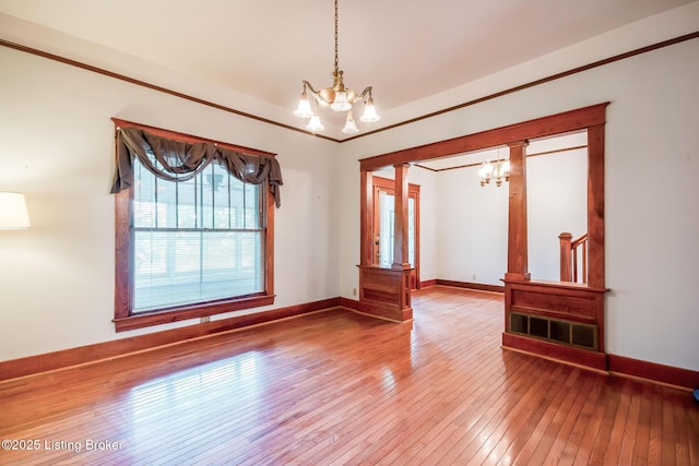 4714 Burkley Ave, Louisville, KY 40214 - empty room with a chandelier, hardwood / wood-style floors, baseboards, and crown molding