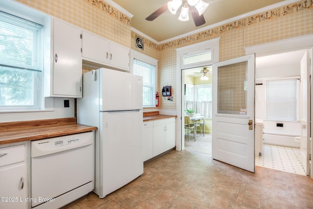 4714 Burkley Ave, Louisville, KY 40214 - kitchen with white appliances, a ceiling fan, wallpapered walls, wooden counters, and white cabinetry