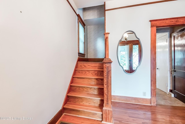 4714 Burkley Ave, Louisville, KY 40214 - staircase with wood finished floors and baseboards
