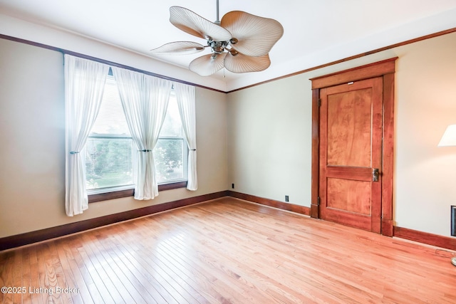 4714 Burkley Ave, Louisville, KY 40214 - unfurnished room with light wood finished floors, baseboards, and a ceiling fan