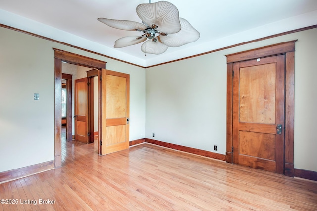 4714 Burkley Ave, Louisville, KY 40214 - unfurnished room featuring light wood finished floors, baseboards, ceiling fan, and ornamental molding
