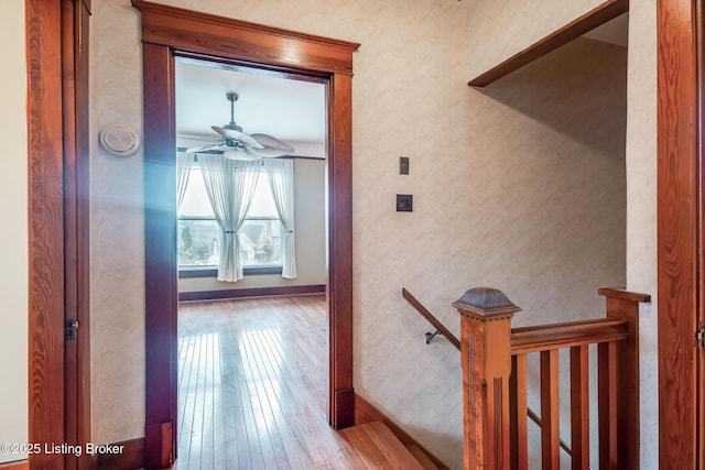 4714 Burkley Ave, Louisville, KY 40214 - hallway with wood-type flooring, an upstairs landing, and baseboards