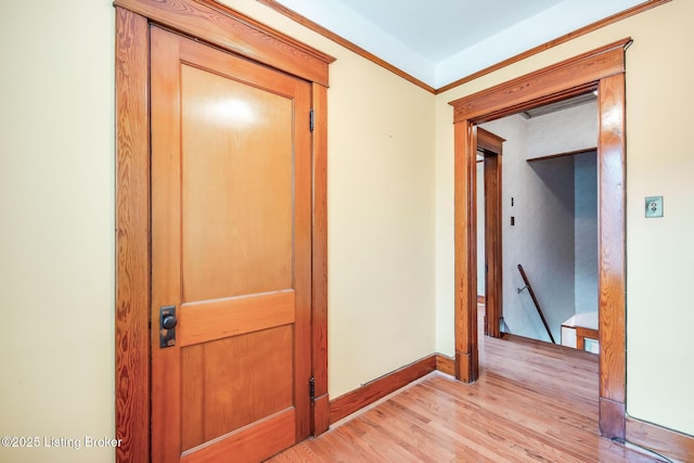 4714 Burkley Ave, Louisville, KY 40214 - hall featuring an upstairs landing, light wood-style flooring, ornamental molding, and baseboards