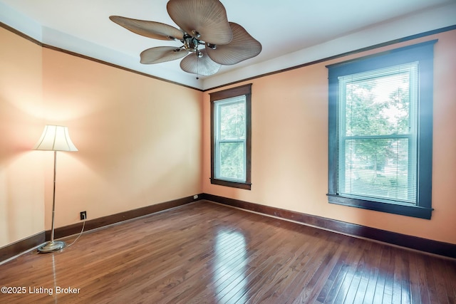 4714 Burkley Ave, Louisville, KY 40214 - spare room featuring wood-type flooring, ceiling fan, and baseboards