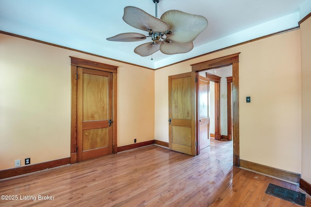 4714 Burkley Ave, Louisville, KY 40214 - empty room featuring baseboards, light wood-style floors, and a ceiling fan