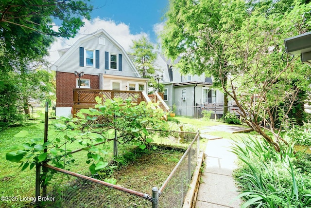 4714 Burkley Ave, Louisville, KY 40214 - back of house featuring a gambrel roof, a deck, and brick siding
