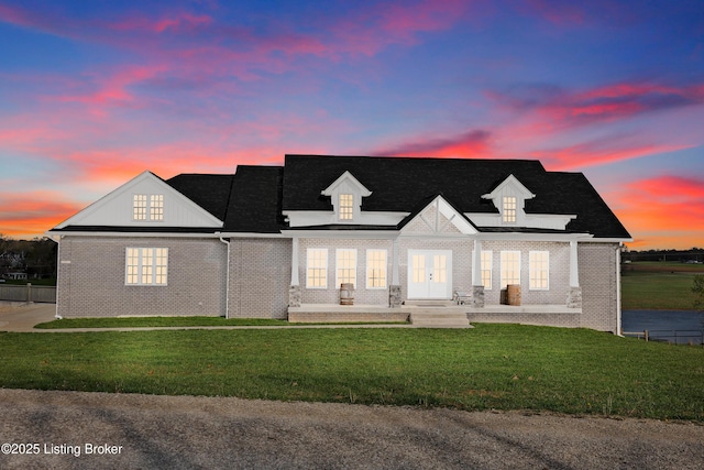 37 Lazy J Ln, Brandenburg, KY 40108 - view of front facade featuring a front lawn, brick siding, and french doors