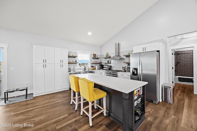 37 Lazy J Ln, Brandenburg, KY 40108 - kitchen with open shelves, stainless steel appliances, wall chimney range hood, white cabinetry, and high vaulted ceiling