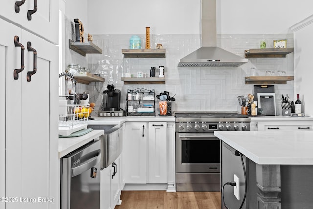37 Lazy J Ln, Brandenburg, KY 40108 - kitchen with open shelves, appliances with stainless steel finishes, wall chimney range hood, and backsplash