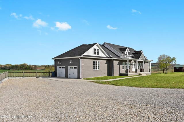 37 Lazy J Ln, Brandenburg, KY 40108 - view of front of property with gravel driveway, brick siding, and an attached garage