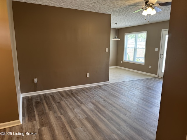 106 Hunter Ln, Brandenburg, KY 40108 - spare room featuring a ceiling fan, wood finished floors, baseboards, and a textured ceiling