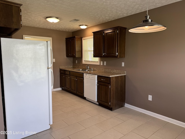 106 Hunter Ln, Brandenburg, KY 40108 - kitchen featuring white appliances, a sink, dark brown cabinetry, baseboards, and light tile patterned floors