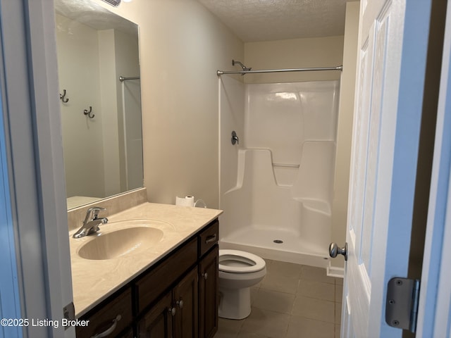 106 Hunter Ln, Brandenburg, KY 40108 - full bathroom featuring tile patterned floors, toilet, vanity, a textured ceiling, and a shower