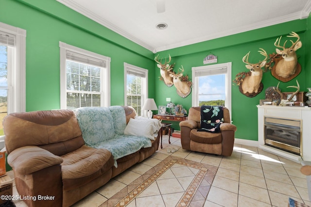 13429 Anneta Rd, Leitchfield, KY 42754 - living area featuring crown molding, light tile patterned floors, plenty of natural light, a glass covered fireplace, and baseboards