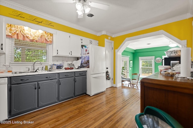 13429 Anneta Rd, Leitchfield, KY 42754 - kitchen with gray cabinetry, white appliances, a sink, decorative backsplash, and healthy amount of natural light