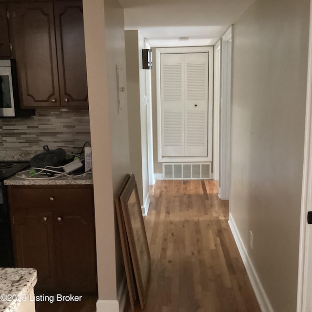 1815 Gardiner Ln Unit A9, Louisville, KY 40205 - corridor featuring light wood finished floors and baseboards