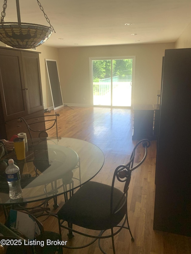 1815 Gardiner Ln Unit A9, Louisville, KY 40205 - dining space with light wood-style floors and baseboards
