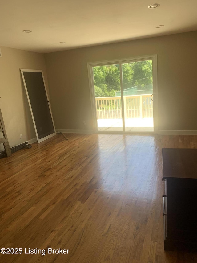 1815 Gardiner Ln Unit A9, Louisville, KY 40205 - spare room with wood finished floors, baseboards, and recessed lighting