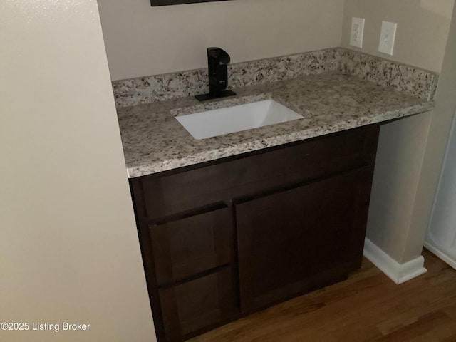 1815 Gardiner Ln Unit A9, Louisville, KY 40205 - bathroom with wood finished floors, baseboards, and vanity