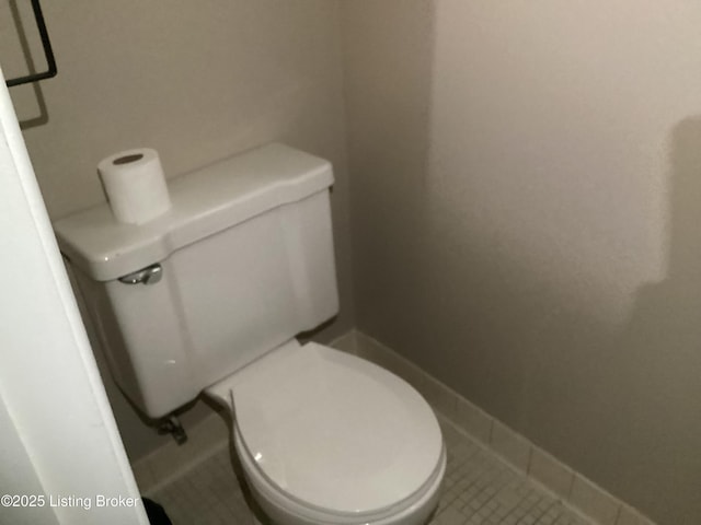 1815 Gardiner Ln Unit A9, Louisville, KY 40205 - bathroom with toilet, baseboards, and tile patterned floors