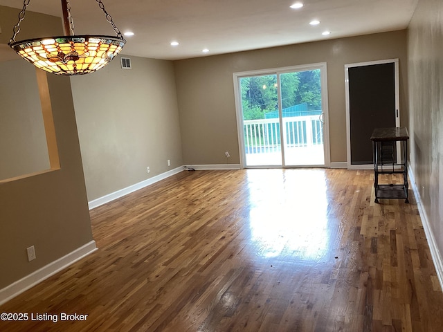 1815 Gardiner Ln Unit A9, Louisville, KY 40205 - unfurnished living room featuring recessed lighting and wood finished floors