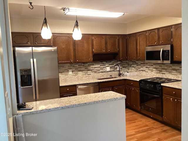 1815 Gardiner Ln Unit A9, Louisville, KY 40205 - kitchen featuring stainless steel appliances, dark brown cabinetry, and tasteful backsplash