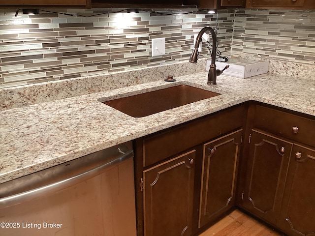 1815 Gardiner Ln Unit A9, Louisville, KY 40205 - kitchen featuring stainless steel dishwasher, tasteful backsplash, and dark brown cabinetry