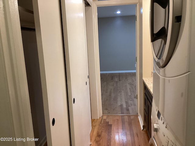 1815 Gardiner Ln Unit A9, Louisville, KY 40205 - washroom featuring light wood-style floors, recessed lighting, and stacked washer / drying machine