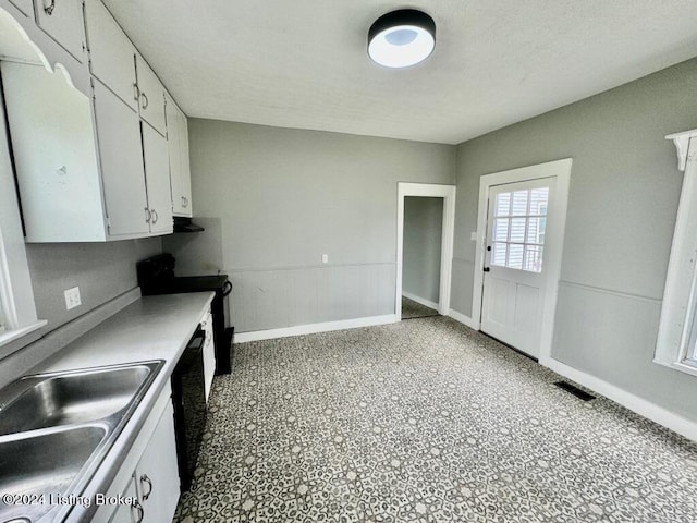 3743 Lincoln Park Rd, Springfield, KY 40069 - kitchen with black appliances, a sink, white cabinets, wainscoting, and extractor fan