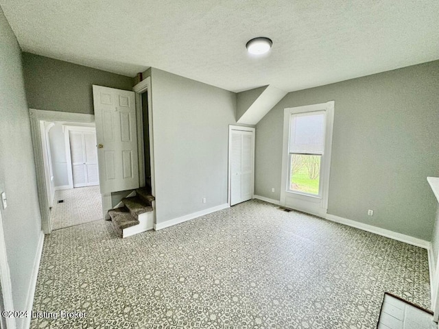 3743 Lincoln Park Rd, Springfield, KY 40069 - bonus room featuring baseboards, stairway, and a textured ceiling