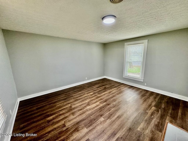3743 Lincoln Park Rd, Springfield, KY 40069 - unfurnished room featuring a textured ceiling, baseboards, and wood finished floors
