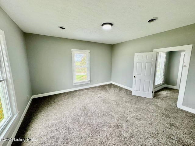 3743 Lincoln Park Rd, Springfield, KY 40069 - spare room featuring carpet flooring, baseboards, and a textured ceiling